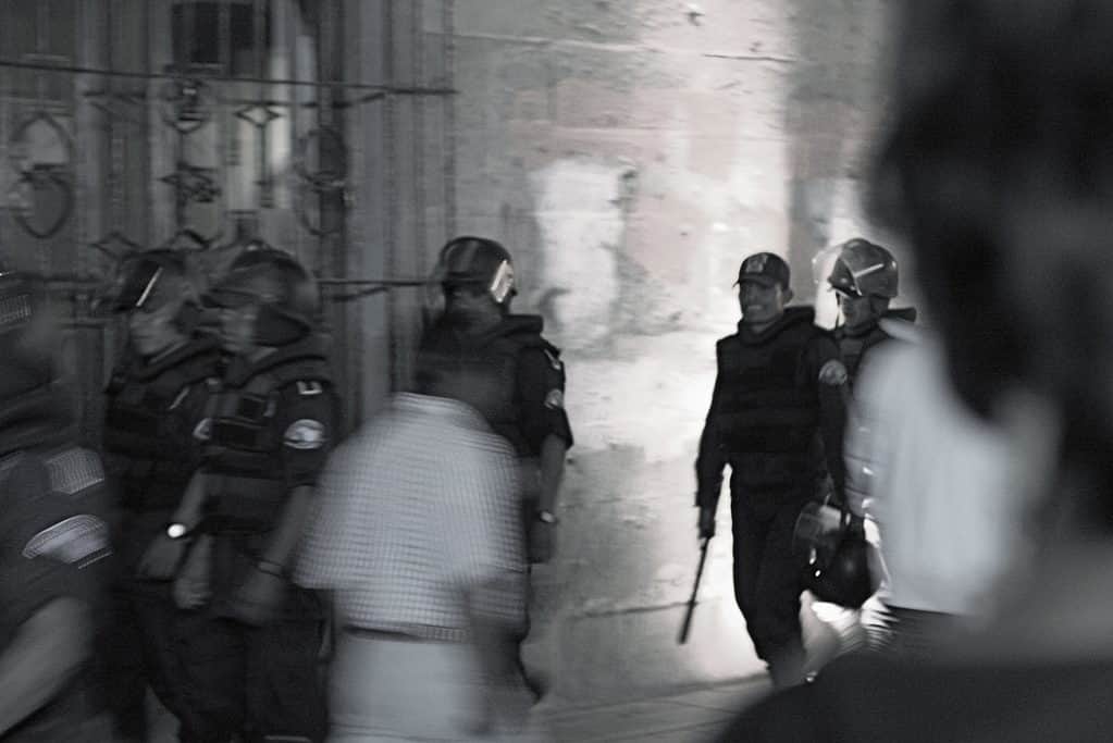 Police in Oaxaca Mexico by drewleavy is licensed under CC BY NC ND 2.0.